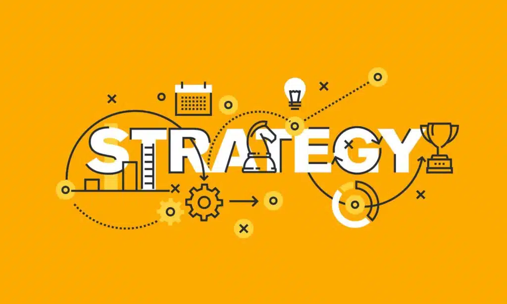 The word "Strategy" on a yellow background, stylized with map markers, a chess piece and a trophy on the right.
